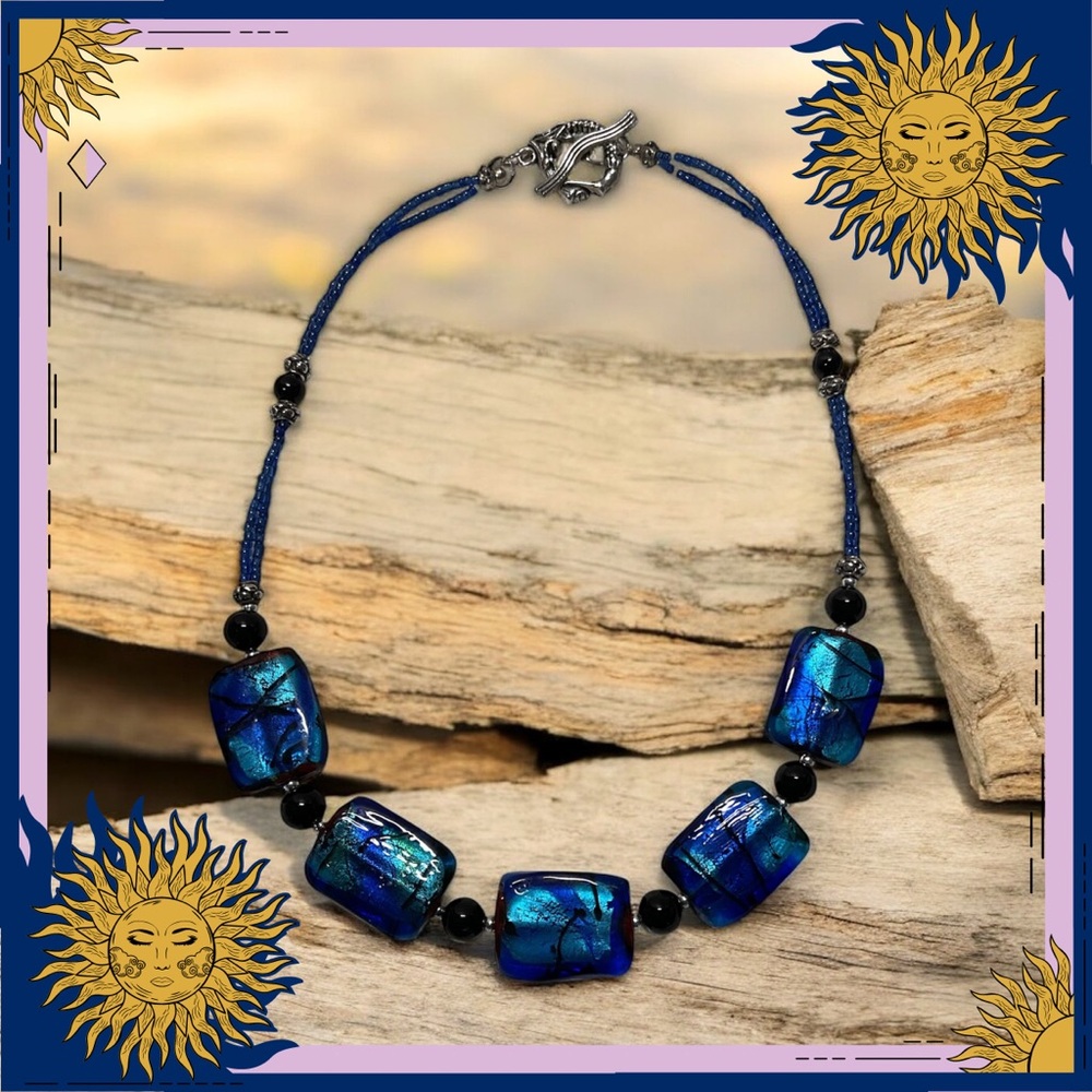 Dichroic Glass and black onyx beaded necklace with mermaid clasp.
